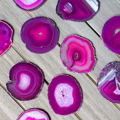 Premium fuchsia agate coaster set with polished natural stone surface and striking organic patterns
