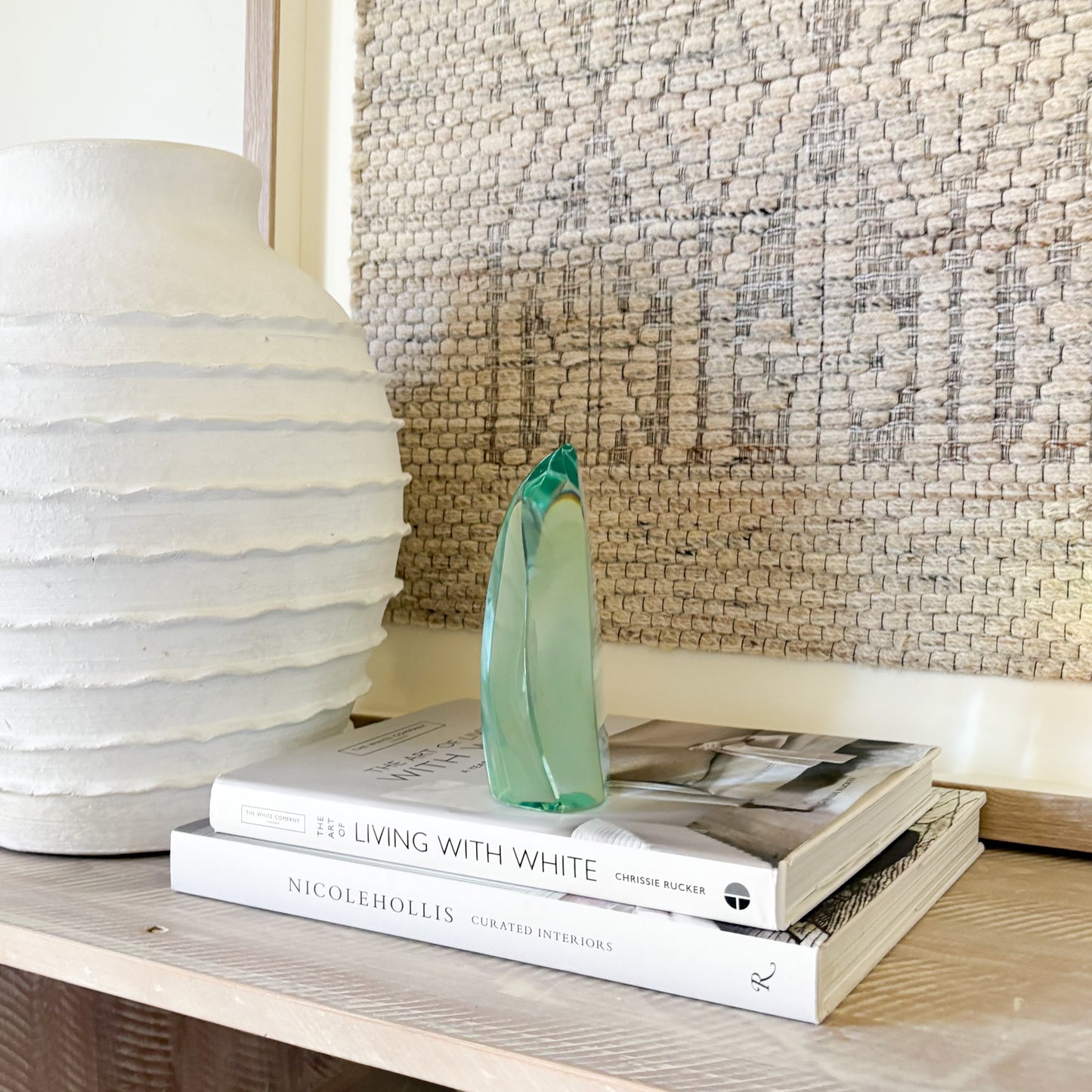 Contemporary green glass sculpture on coffee table with natural light