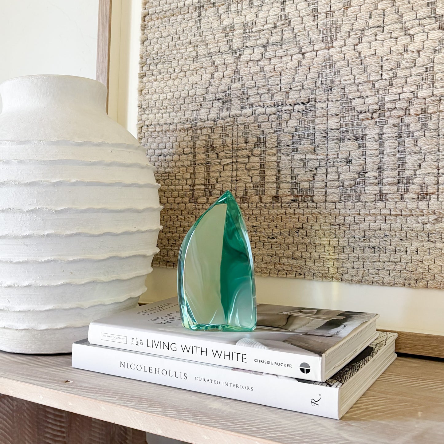 Green glass sculpture with modern abstract curved form