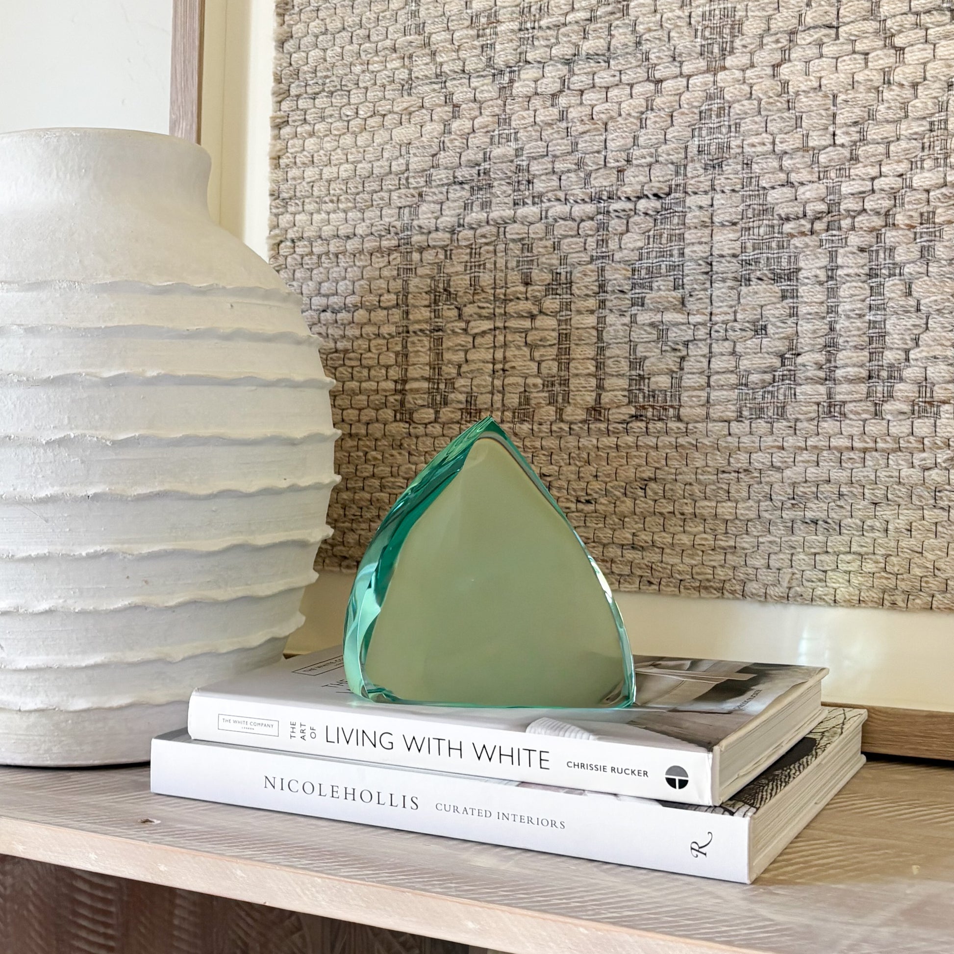 Green glass sculpture with modern abstract curved form