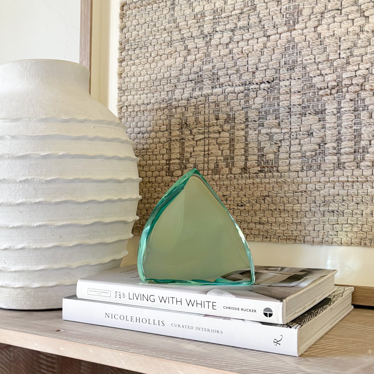 Minimalist green glass sculpture with clean abstract lines