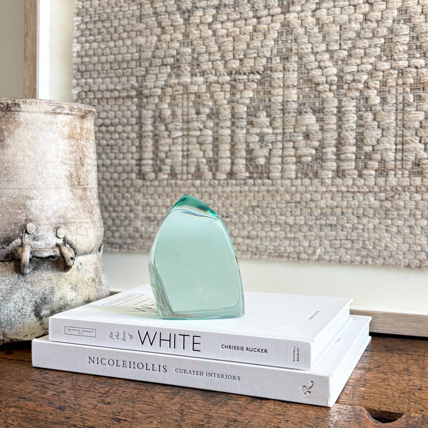 Contemporary green glass sculpture on coffee table with natural light