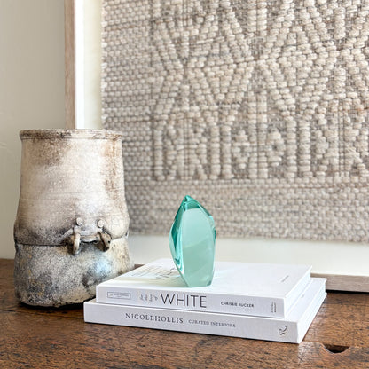 Modern green glass sculpture with polished translucent finish