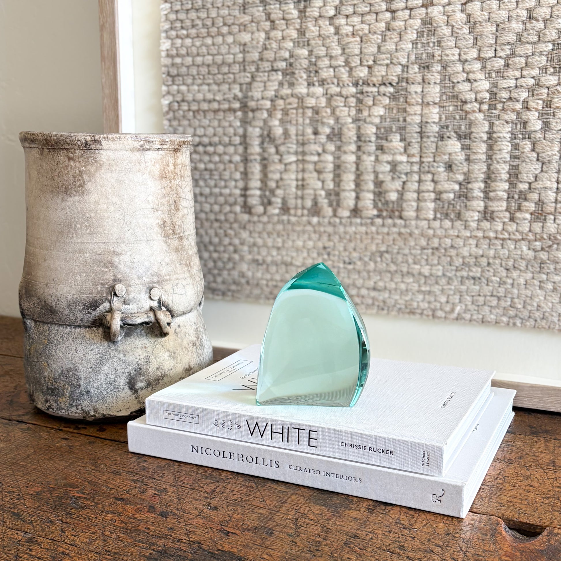 Green glass sculpture with sculptural wave design and glossy finish