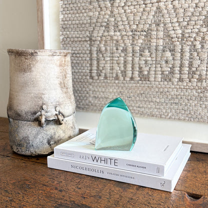 Green glass sculpture with sculptural wave design and glossy finish