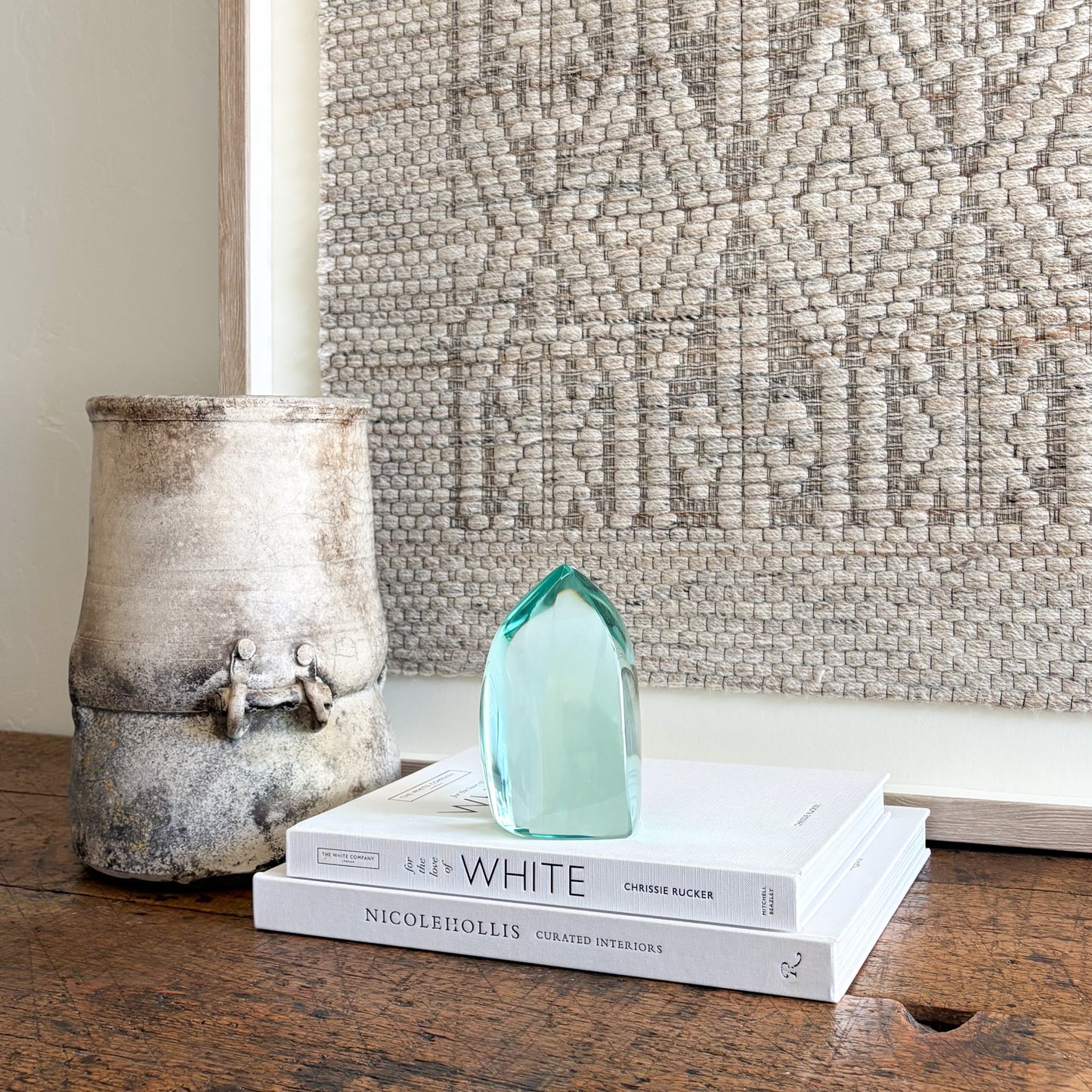 Contemporary green glass sculpture on coffee table with natural light