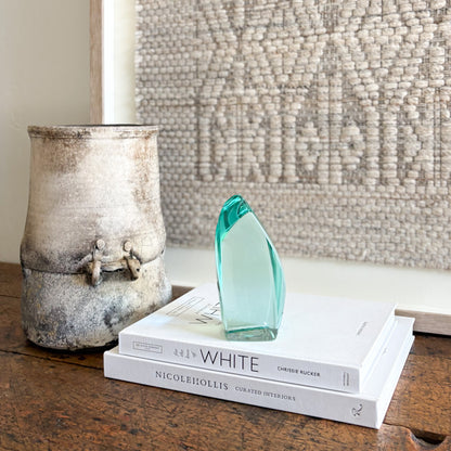 Modern green glass sculpture with polished translucent finish