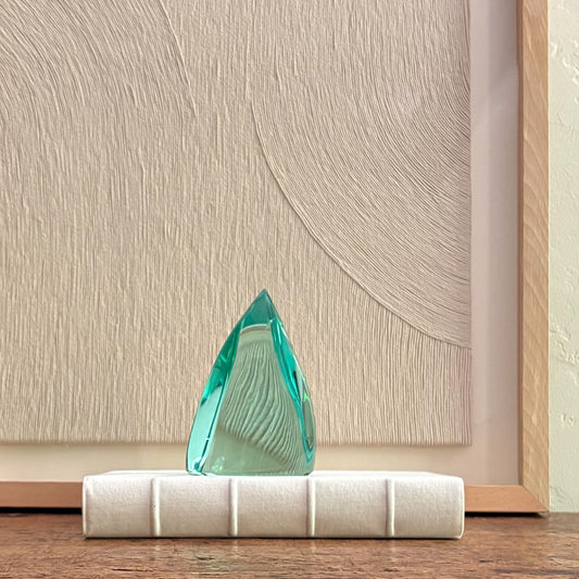 Modern abstract green glass sculpture with crystal-like form and glossy finish for home decor