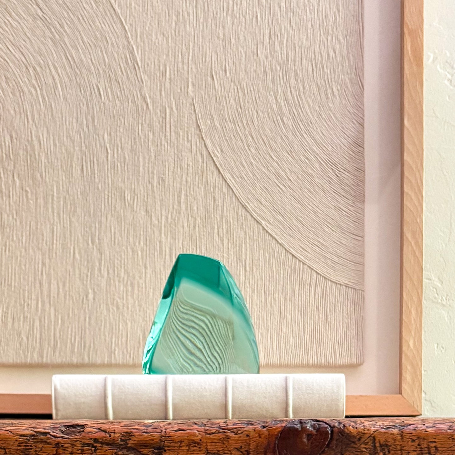 Abstract green glass sculpture with glossy finish