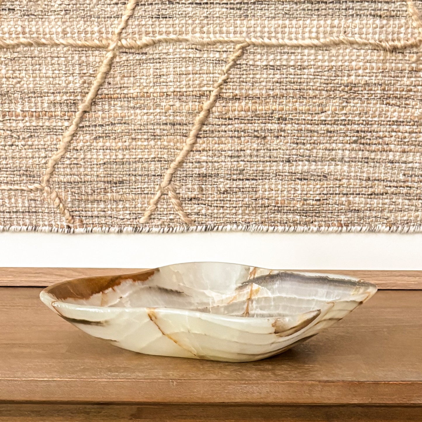 Hand carved green onyx bowl with natural stone veining for luxury home decor
