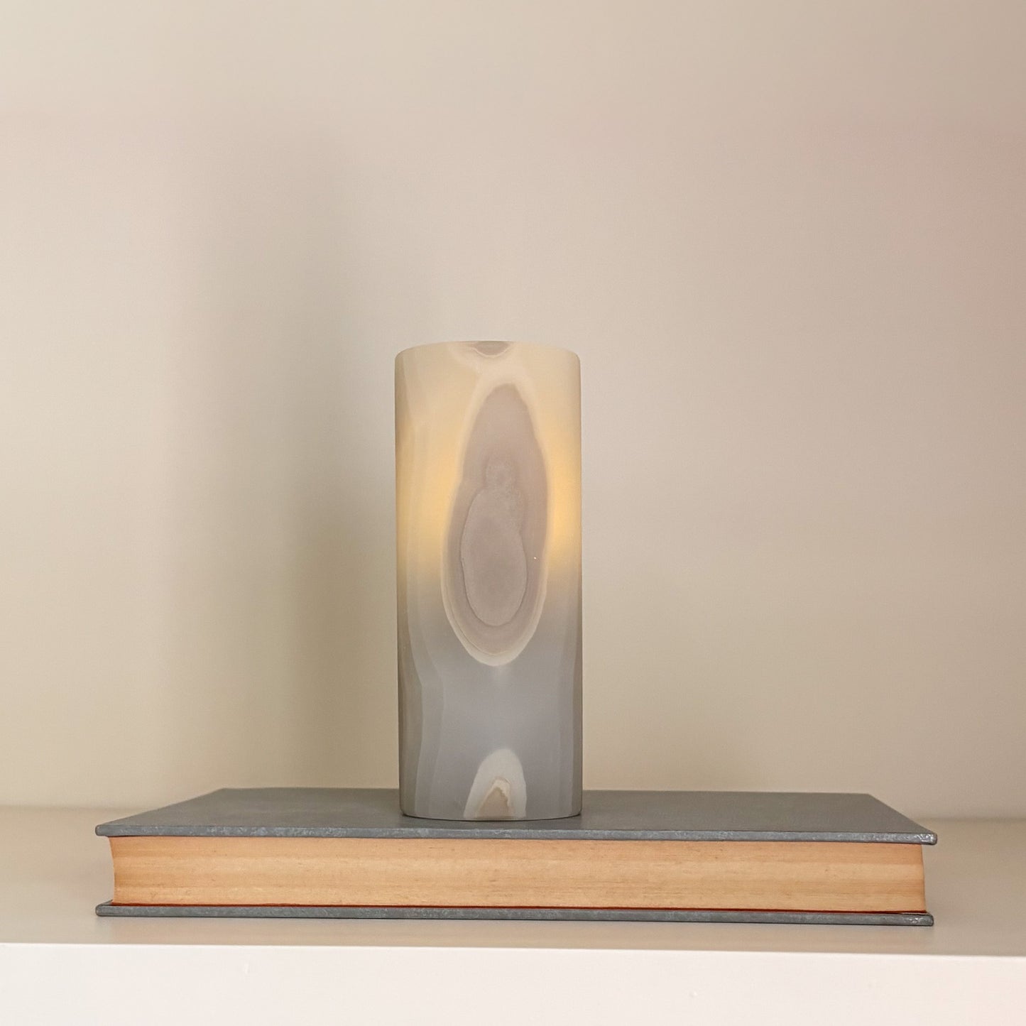 High-end artisanal candle holders in polished grey aragonite crystal