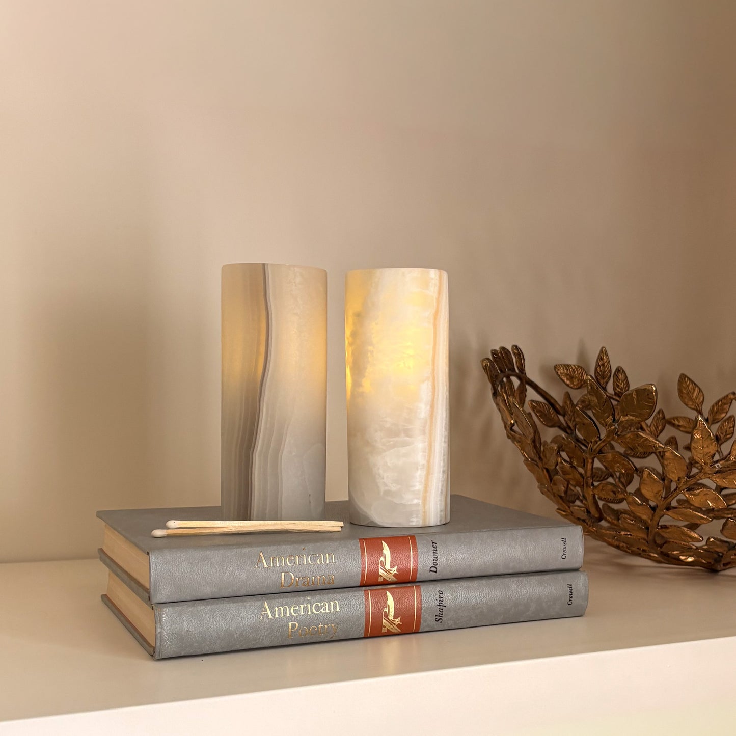 Handcrafted grey aragonite candle holders in artisanal natural stone décor setting