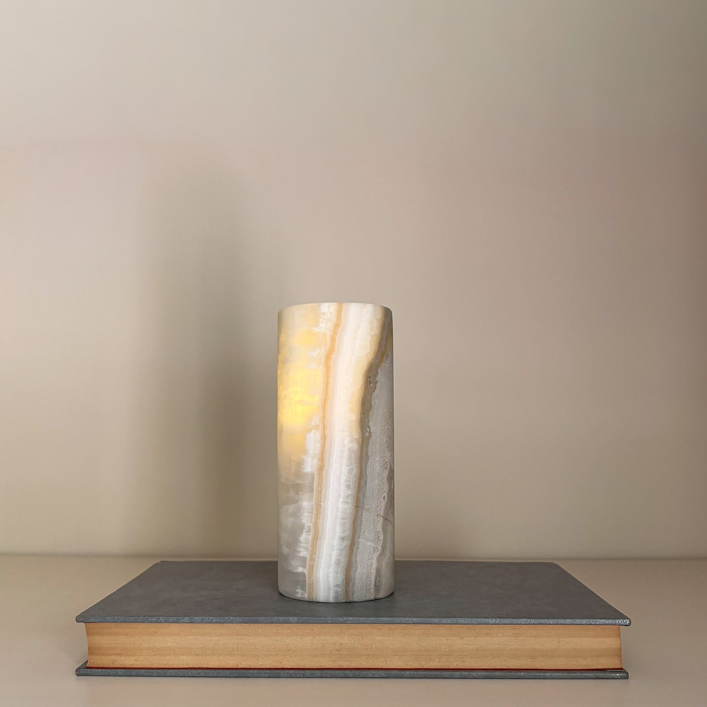 Elegant crystal tealight candle holders styled with designer coffee table books