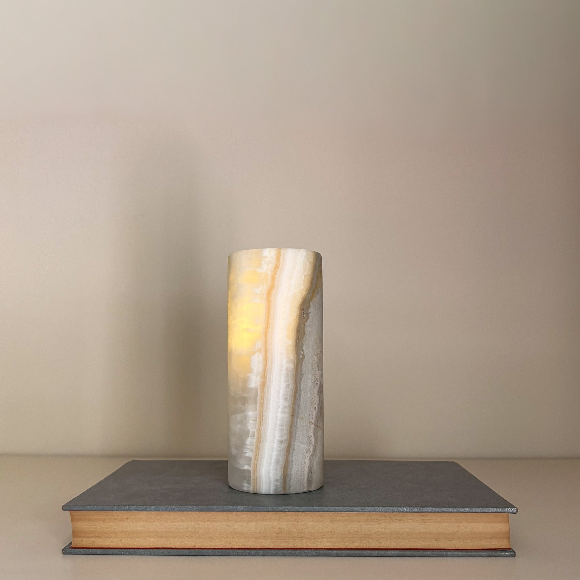 Elegant crystal tealight candle holders styled with designer coffee table books