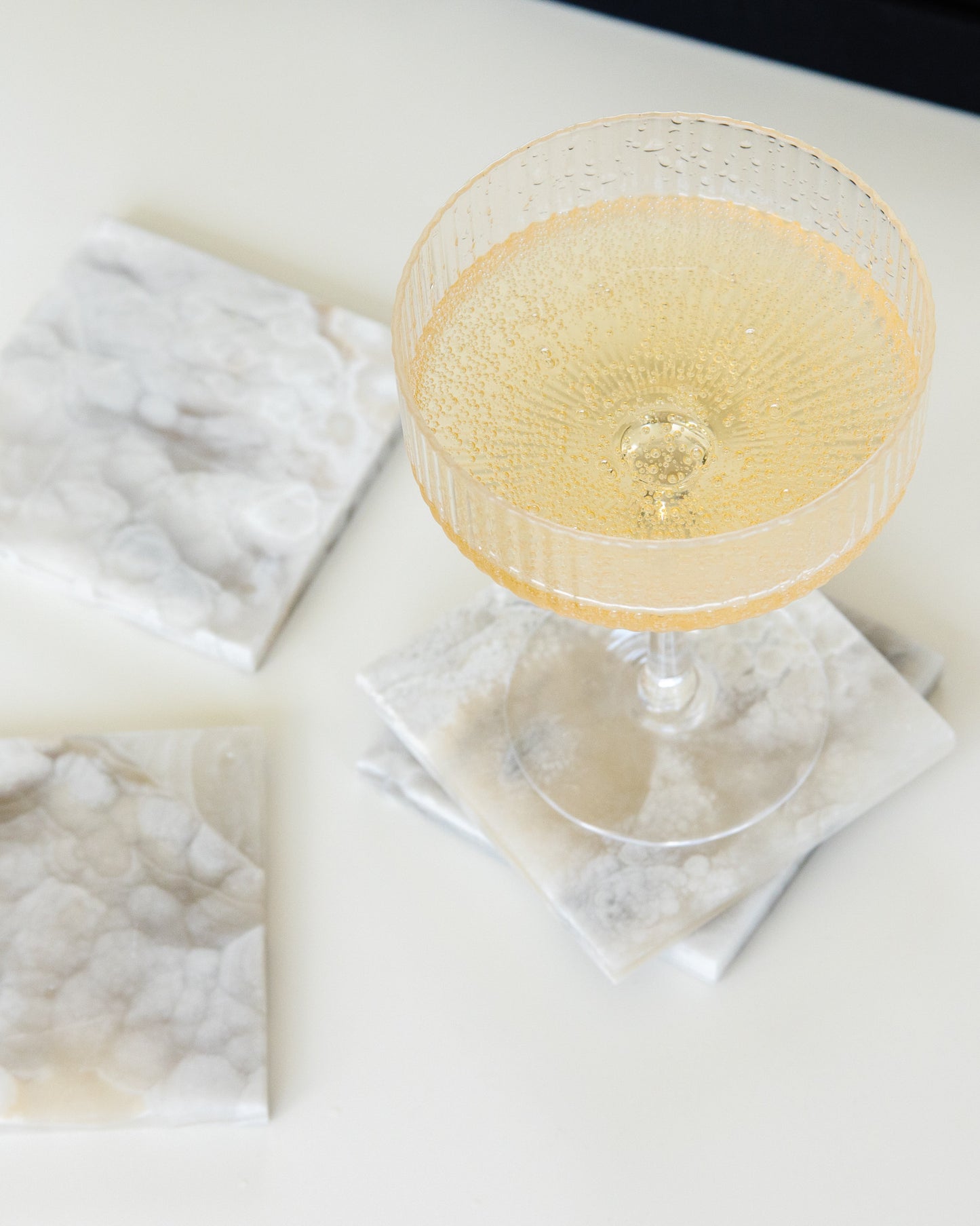 Grey onyx stone coaster set with polished finish for modern organic and contemporary interiors