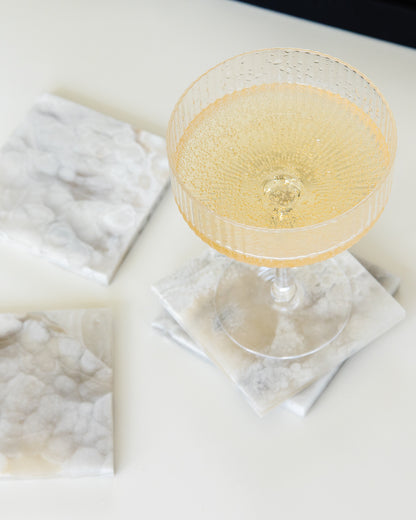 Grey onyx stone coaster set with polished finish for modern organic and contemporary interiors