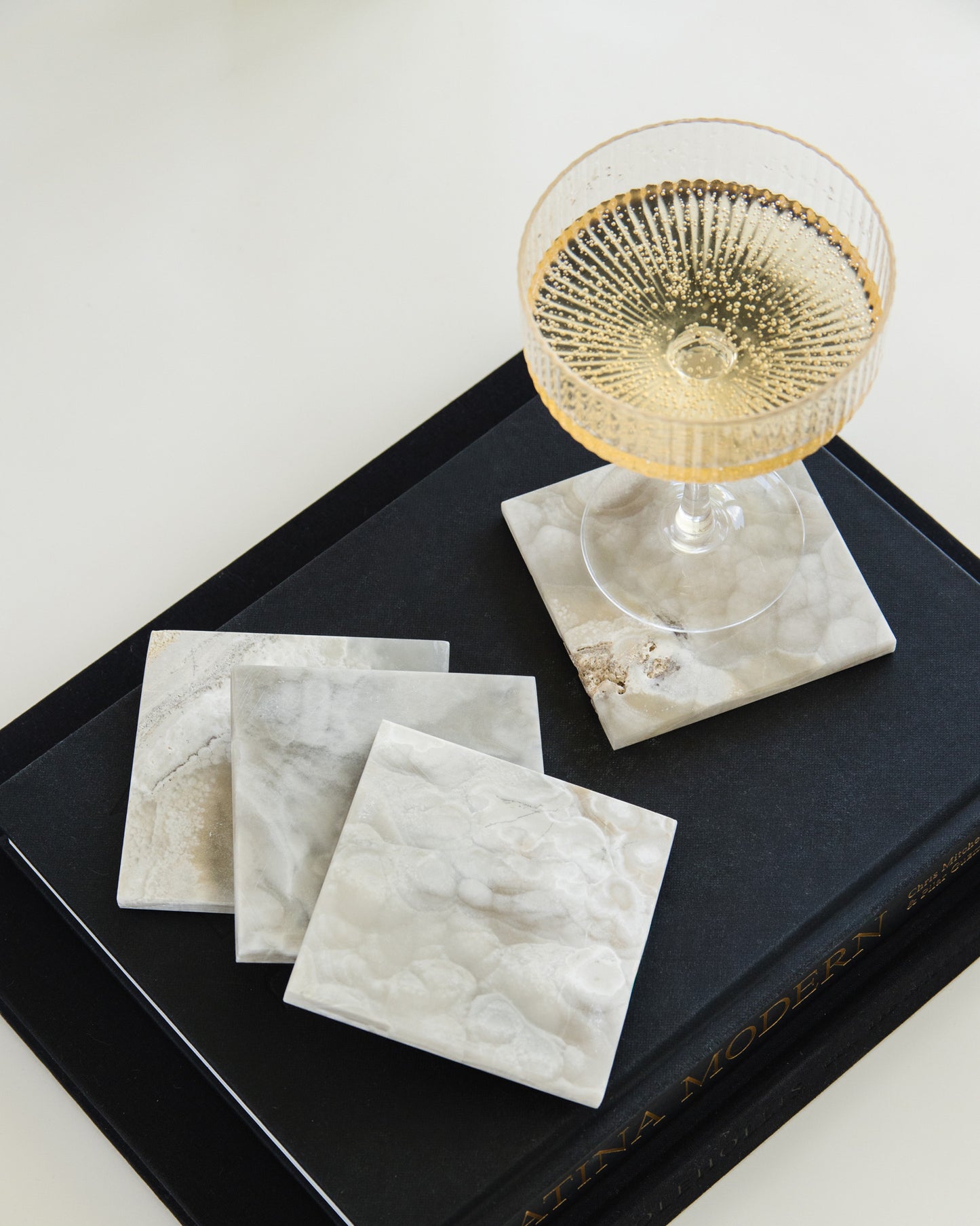 Authentic grey onyx stone coasters with distinctive veining and polished edges