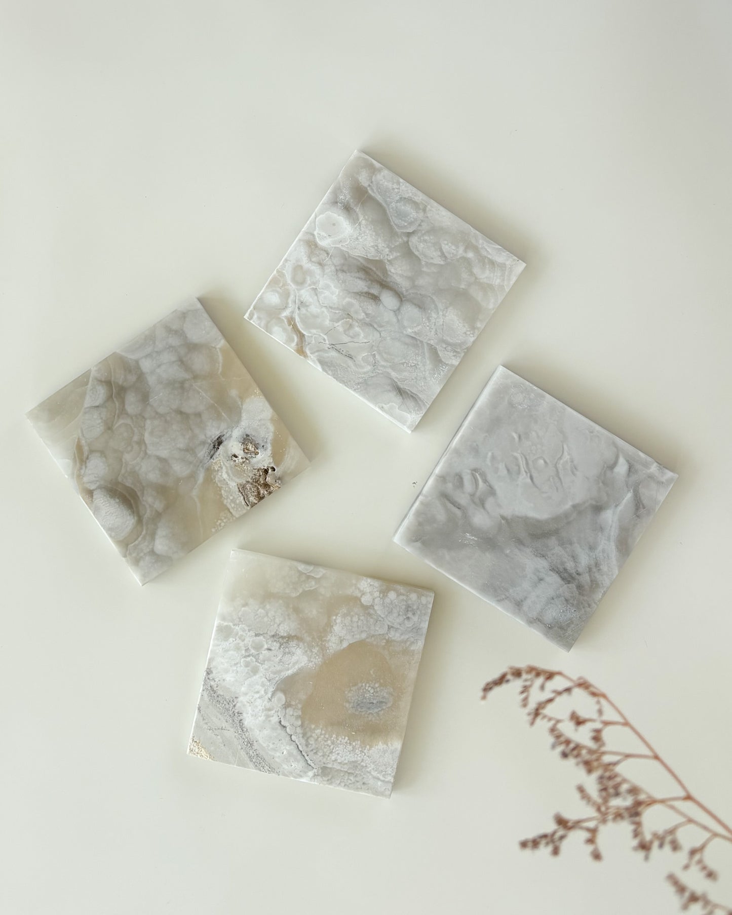 Grey onyx coaster set with rich natural color variation and polished craftsmanship