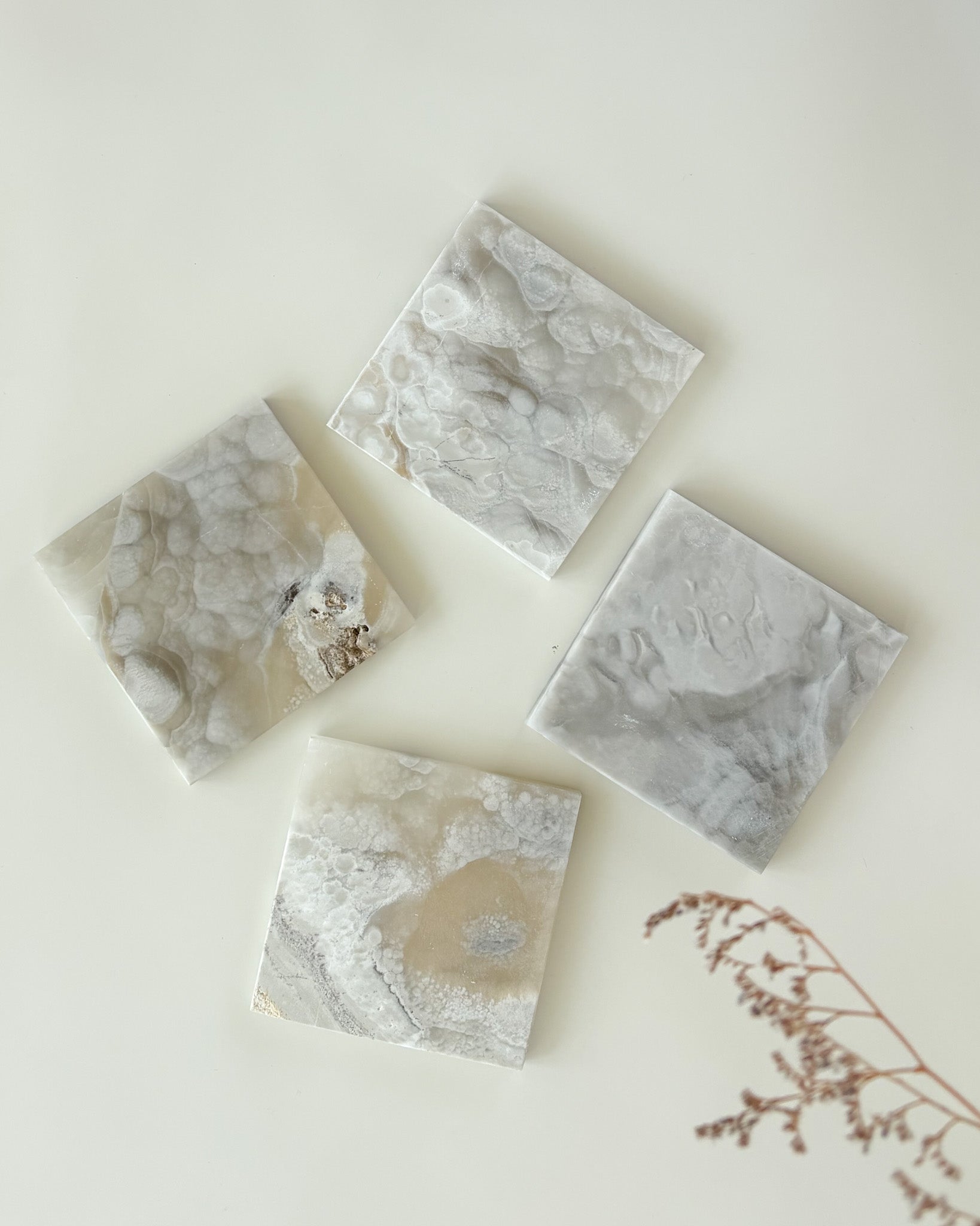Grey onyx coaster set with rich natural color variation and polished craftsmanship