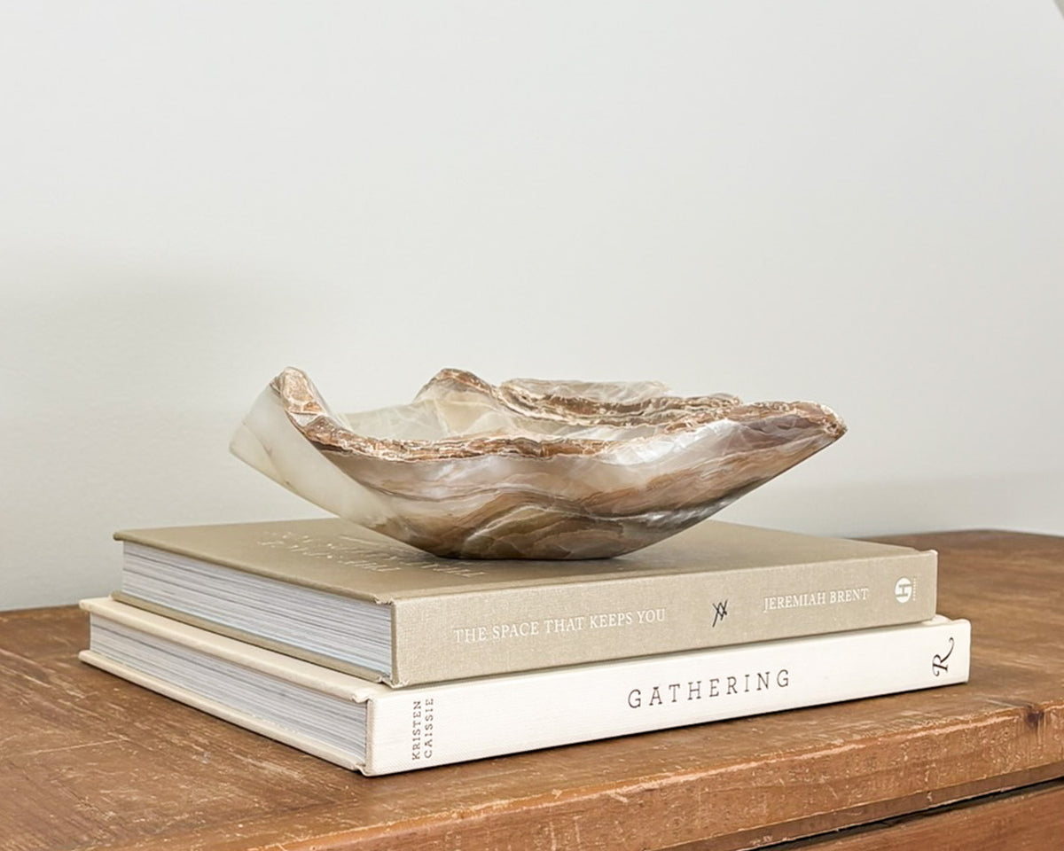 One-of-a-kind amber onyx decorative bowl featuring rich honey-colored banding