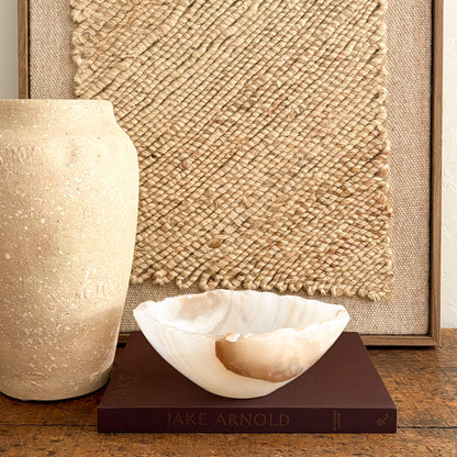 Translucent amber onyx bowl, carved and polished from natural stone