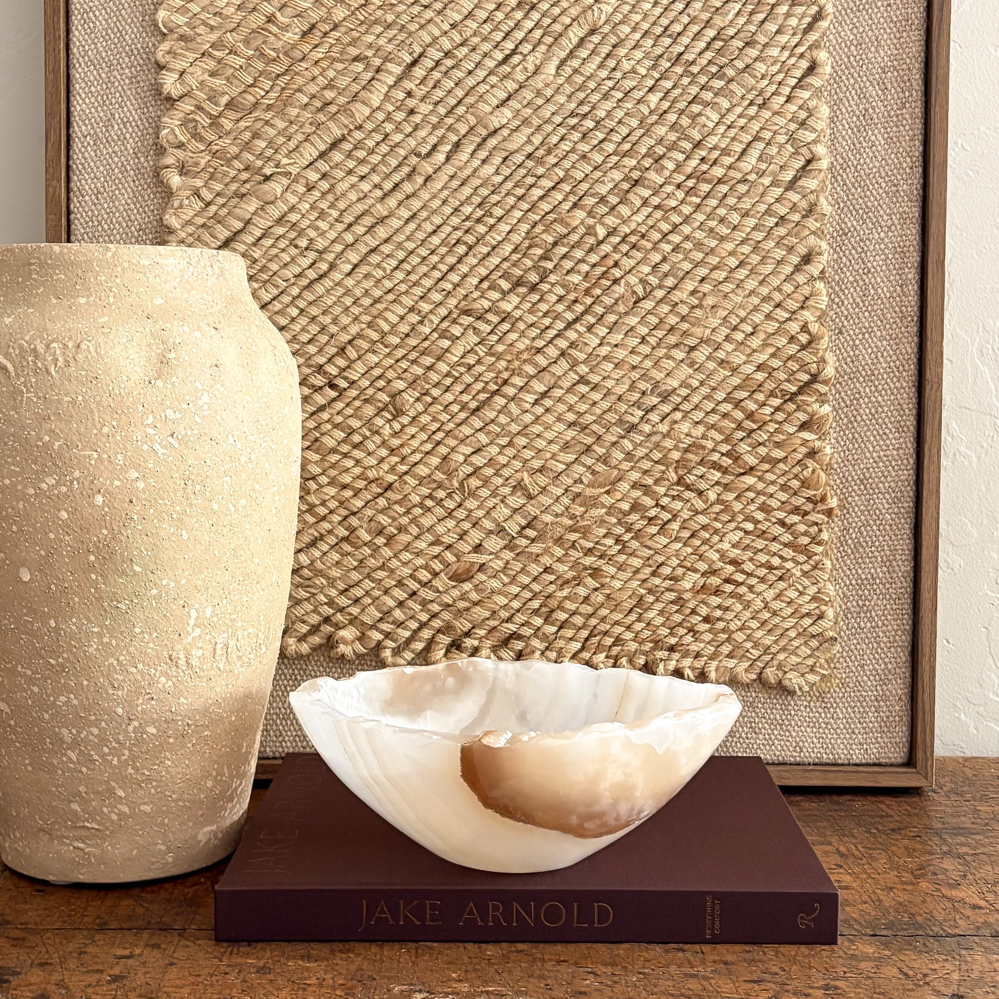 Handmade amber onyx bowl on tabletop, warm golden glow
