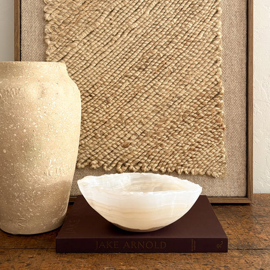 Translucent amber onyx bowl, carved and polished from natural stone