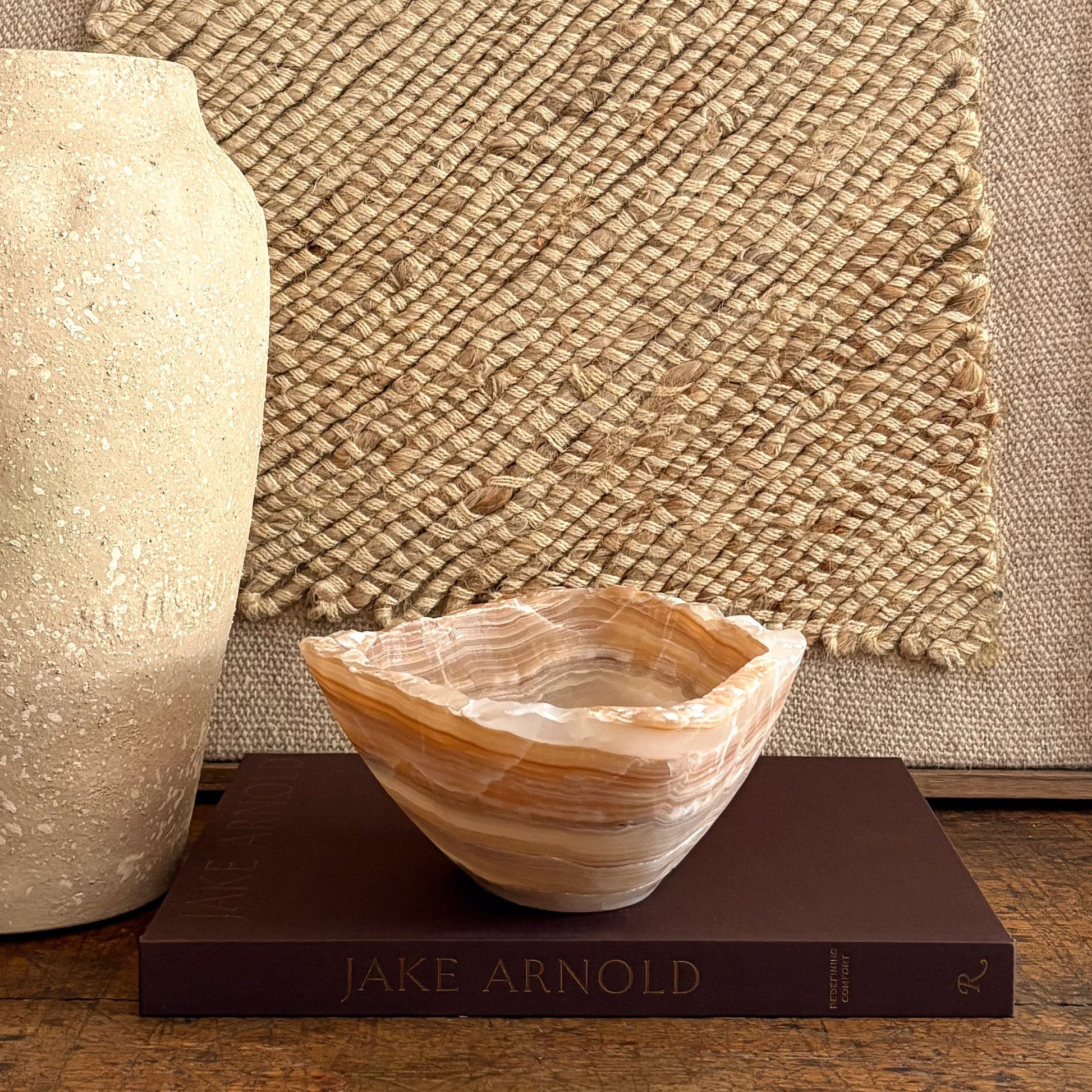 Amber onyx centerpiece bowl, hand-carved with natural stone striping