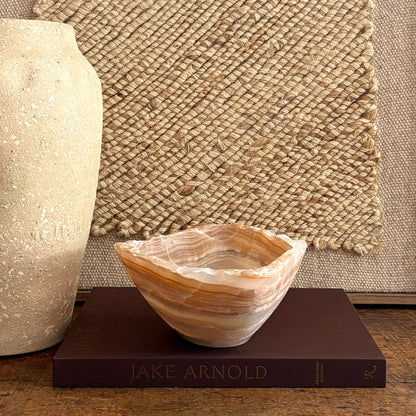 Amber onyx centerpiece bowl, hand-carved with natural stone striping