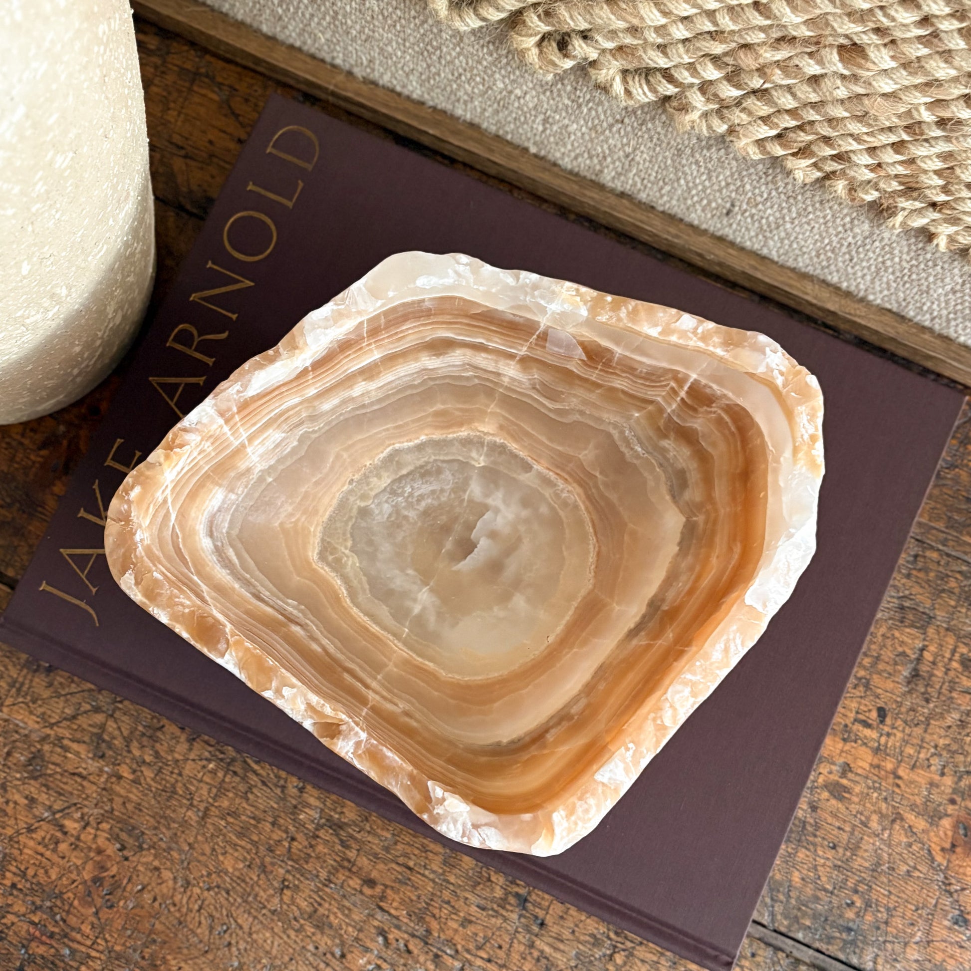 Amber onyx bowl viewed from above, smooth interior with swirling veins