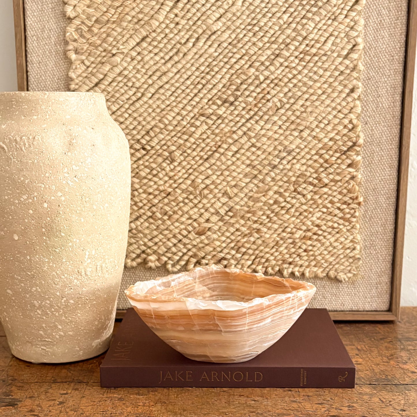 Handmade amber onyx bowl on tabletop, warm golden glow