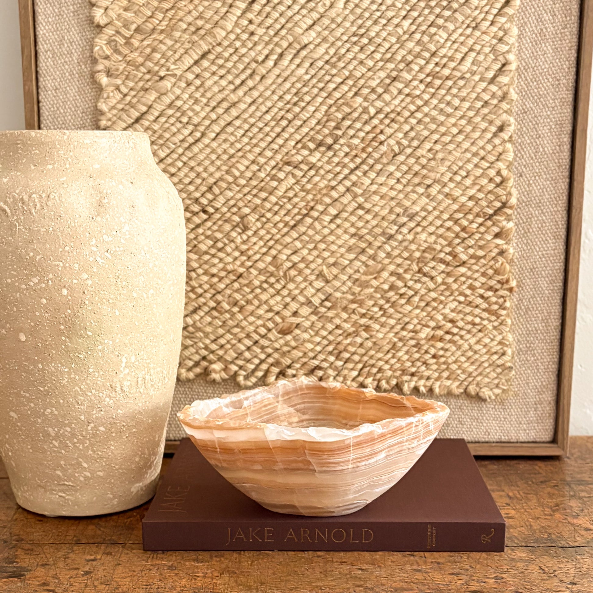 Handmade amber onyx bowl on tabletop, warm golden glow