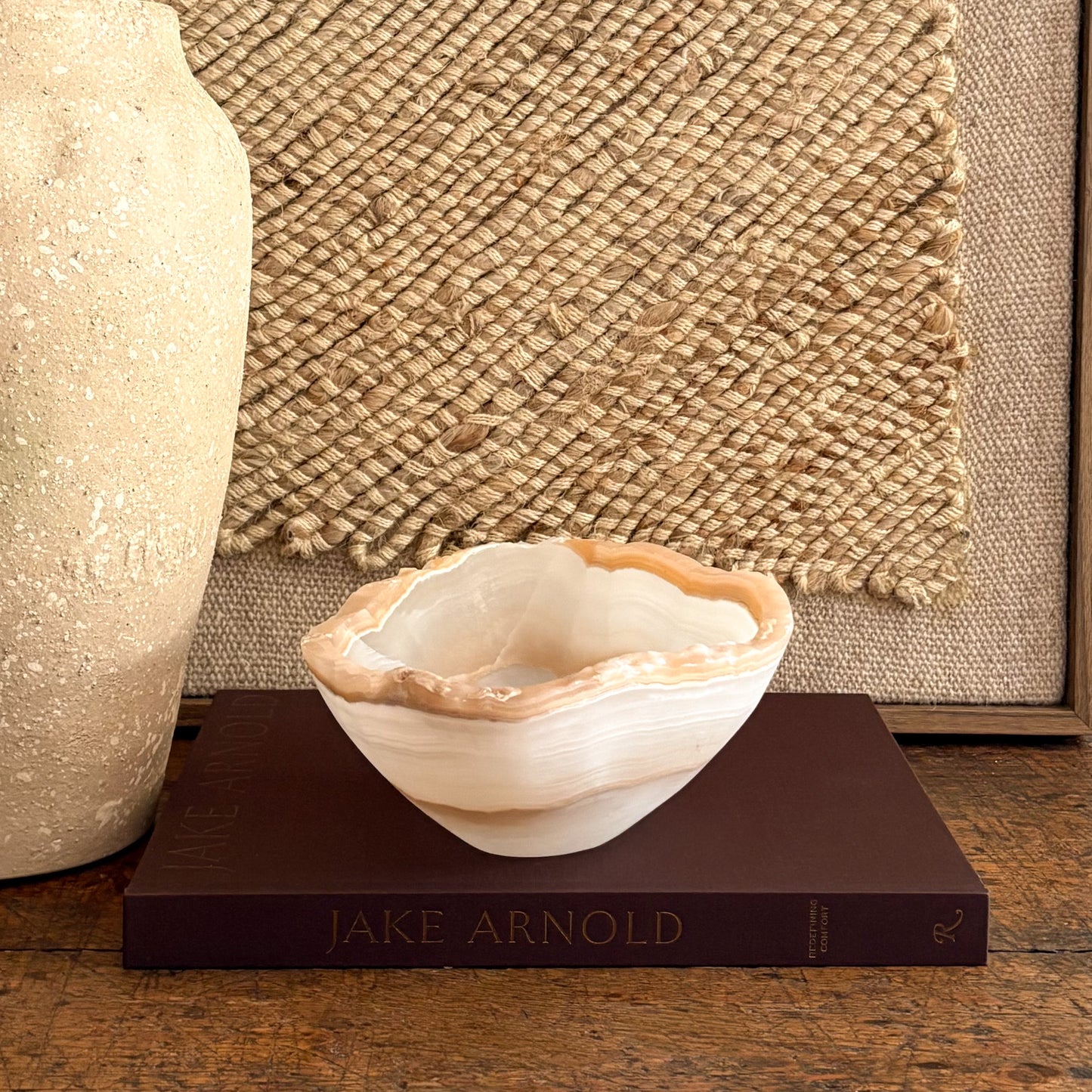 Small hand-carved amber onyx catchall bowl, luminous banded stone