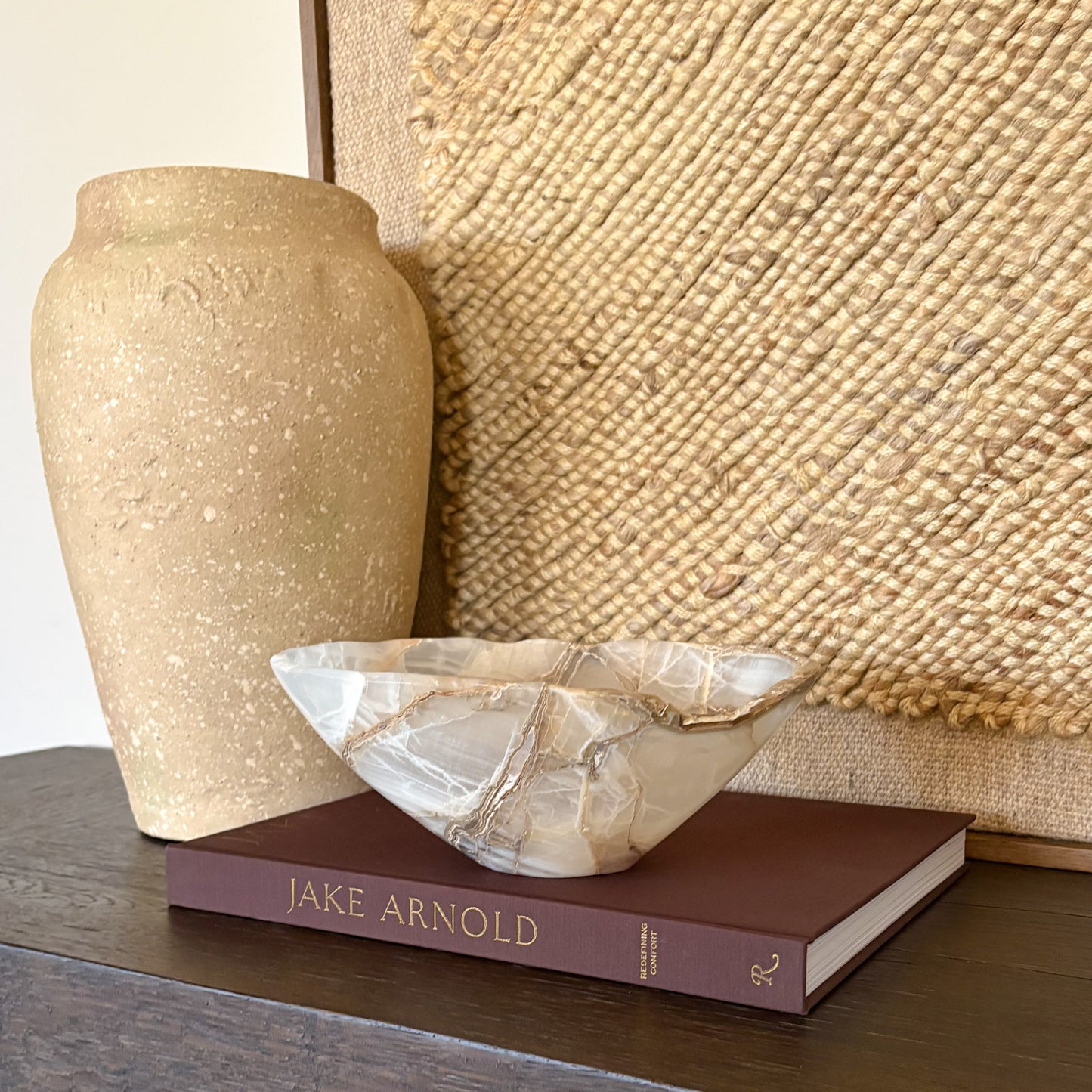 Hand carved amber onyx bowl displayed on modern dining table decor