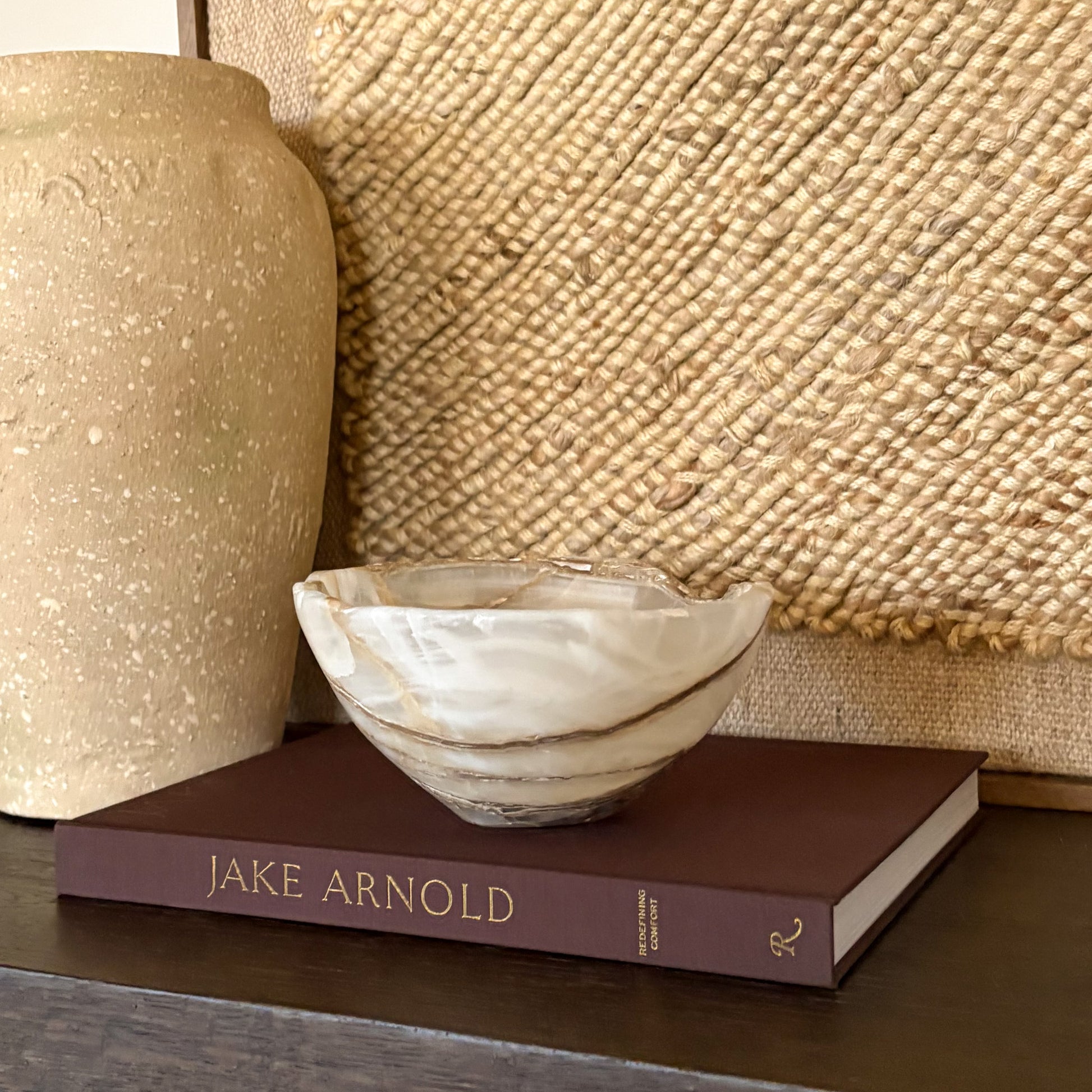 Hand carved amber onyx bowl made from natural stone with warm honey-gold tones