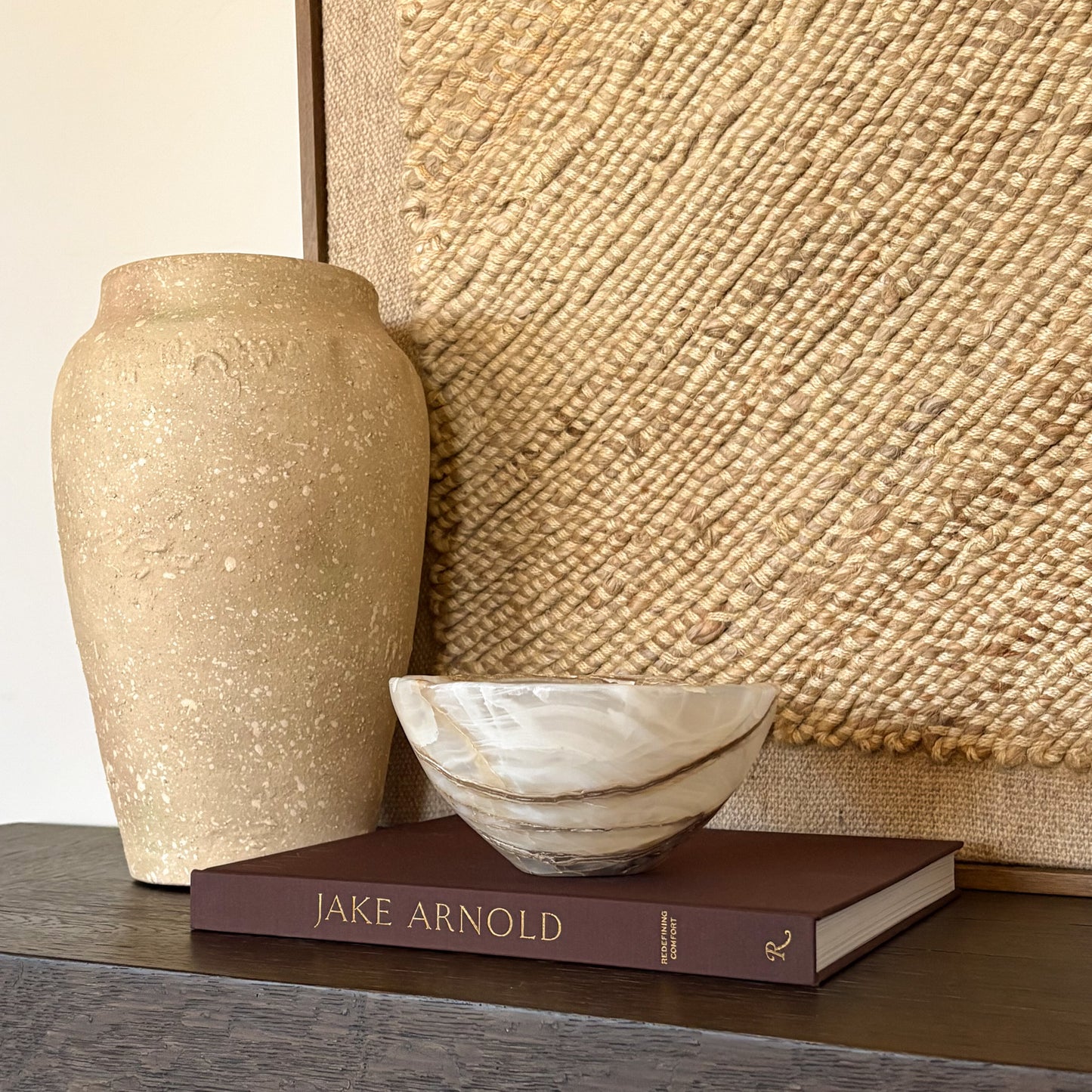 Handmade amber onyx stone bowl with smooth carved edges and rich color