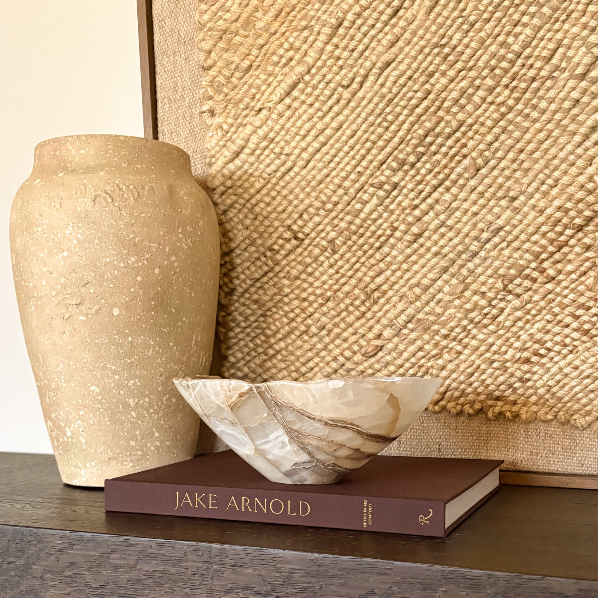 Decorative amber onyx bowl used as a centerpiece in a luxury home setting