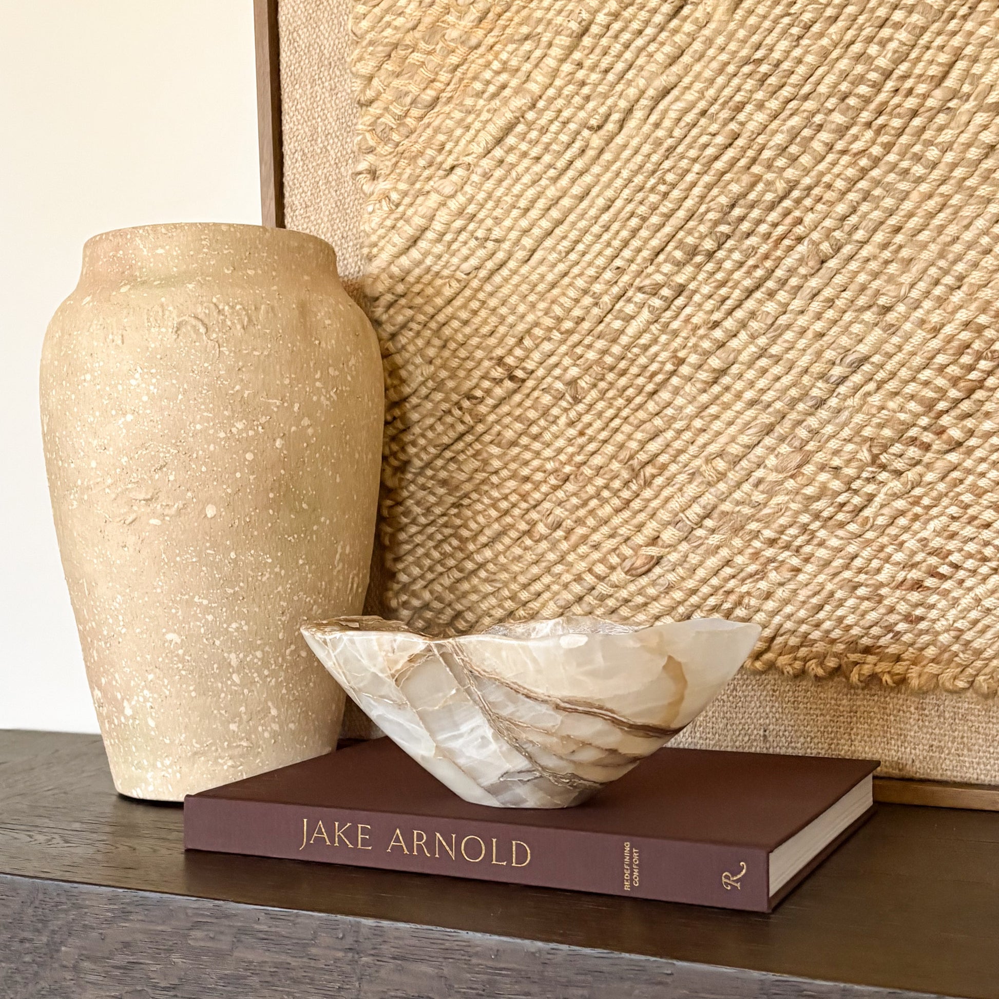 Hand carved amber onyx bowl with polished finish and natural stone veining”