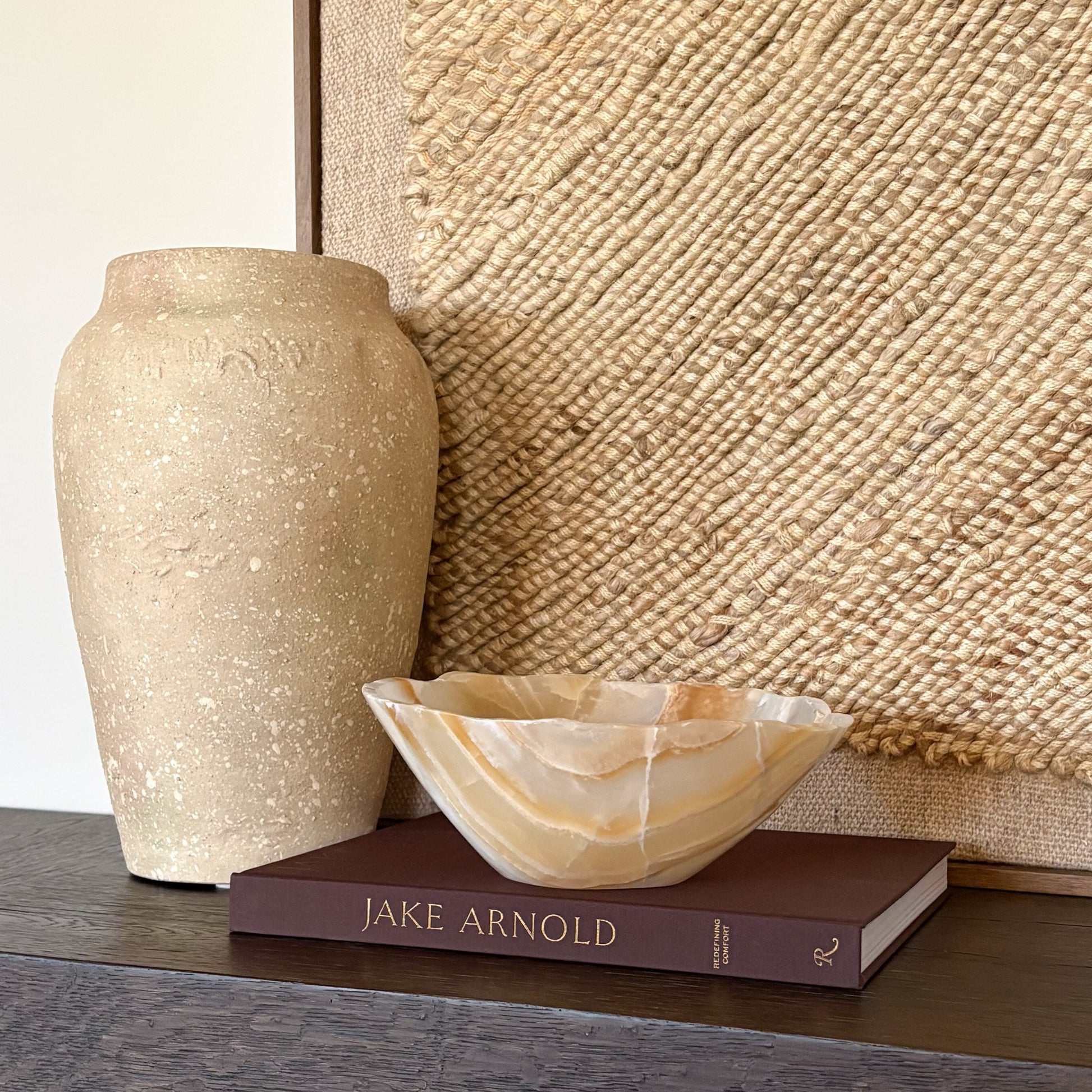 Artisan hand carved amber onyx bowl showcasing warm golden hues