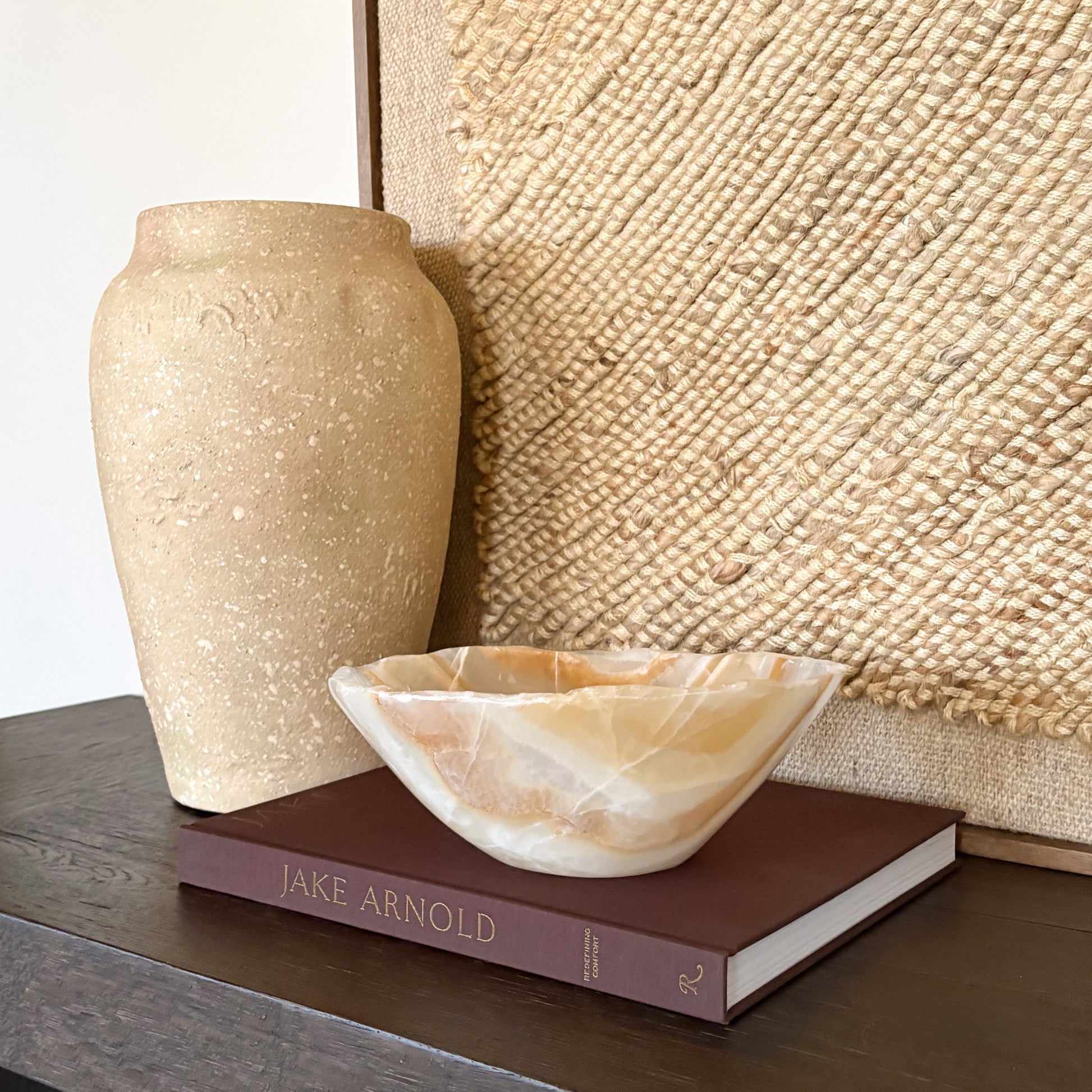 Hand carved amber onyx bowl with natural stone veining and polished finish