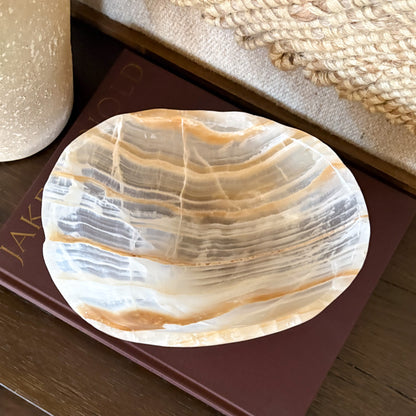Amber onyx bowl displayed as luxury home decor accent