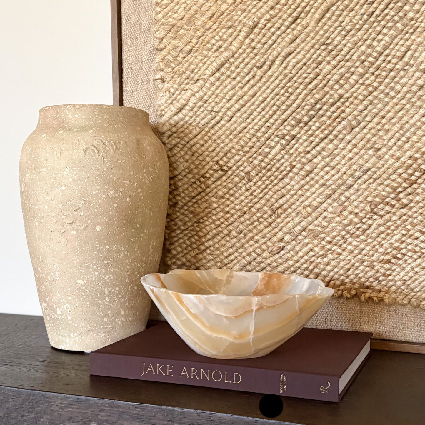 Hand carved amber onyx bowl used as a decorative centerpiece on table