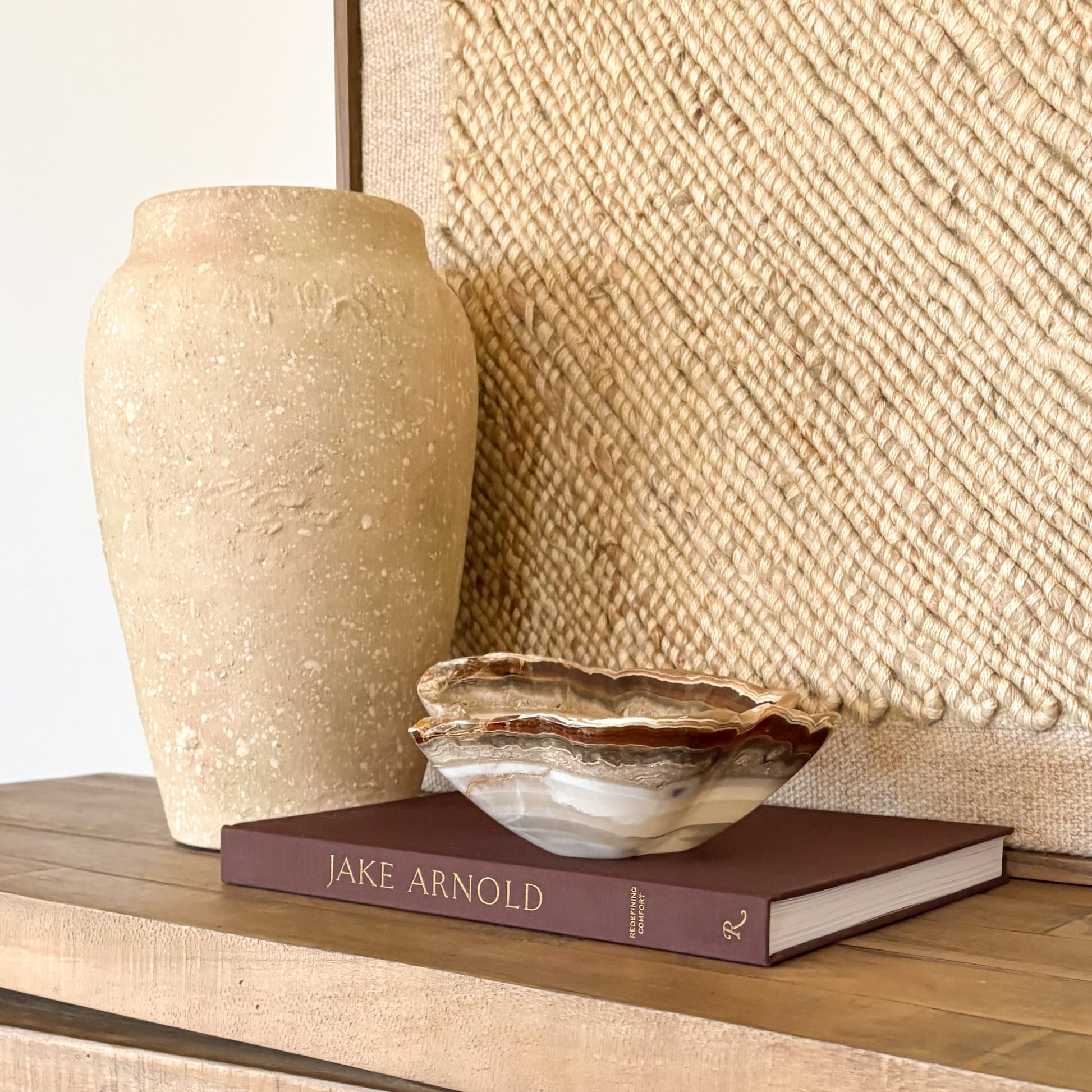 decorative hand carved amber onyx bowl used as a luxury home decor accent