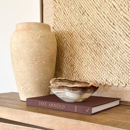 decorative hand carved amber onyx bowl used as a luxury home decor accent