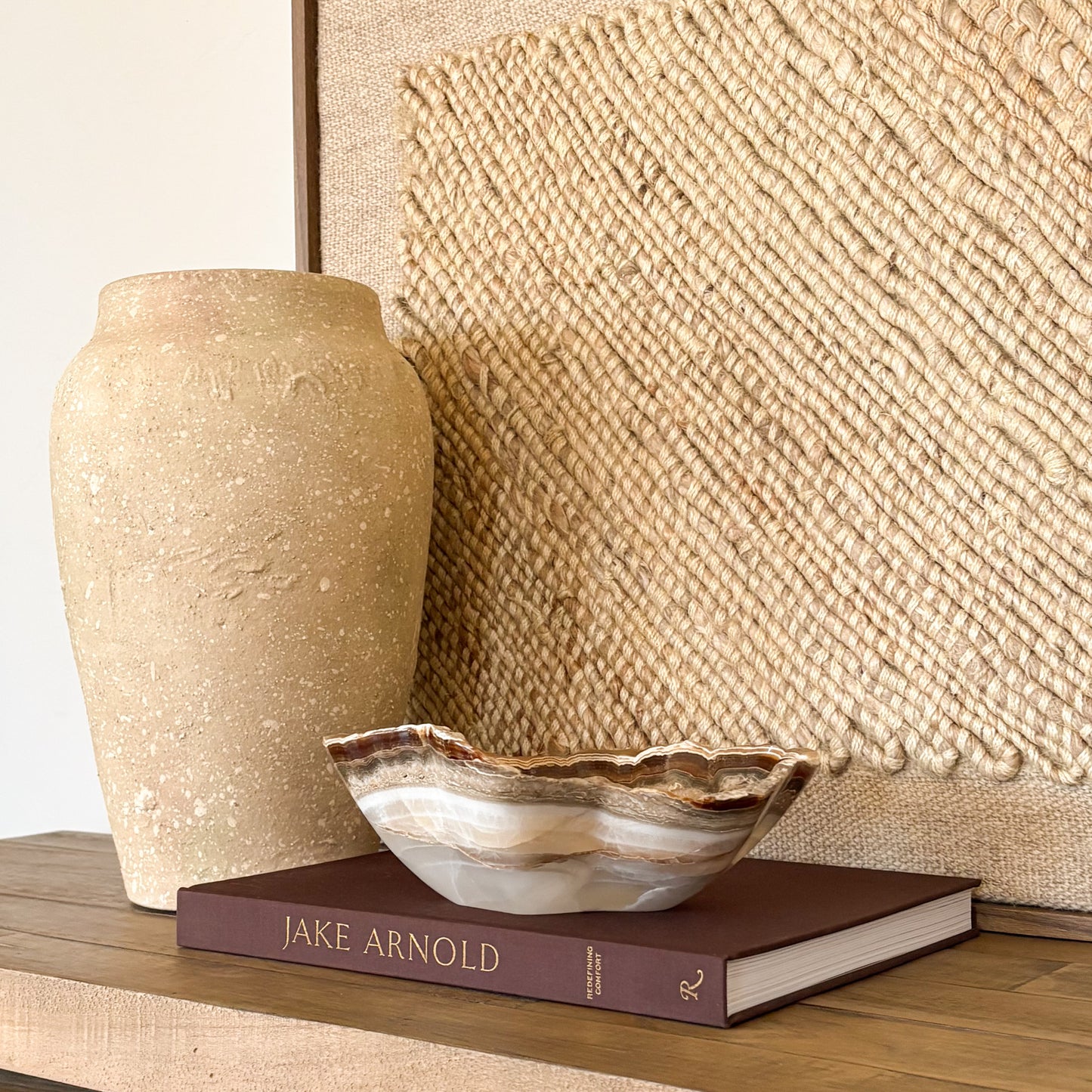 Hand carved amber onyx bowl featuring polished natural stone and unique veining