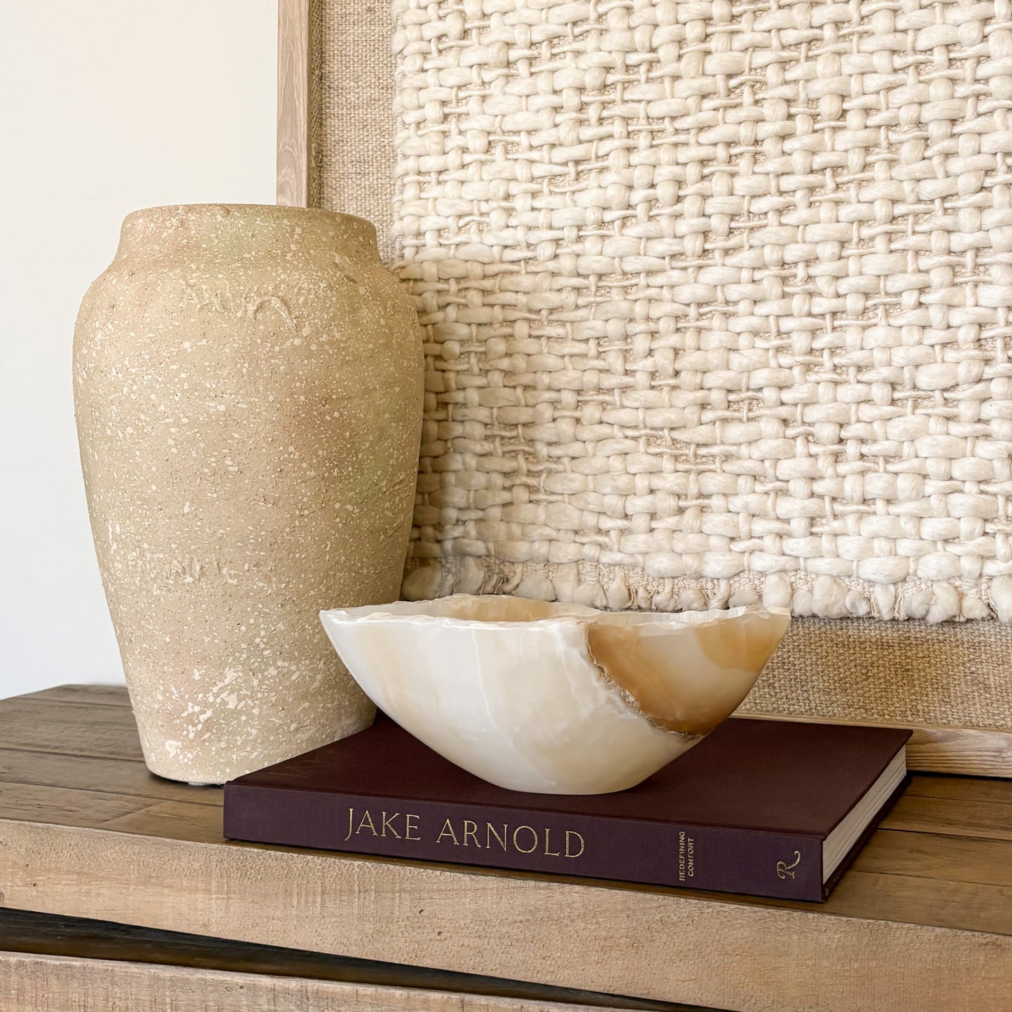 hand-carved amber onyx bowl with natural stone veining, decorative artisan stone bowl