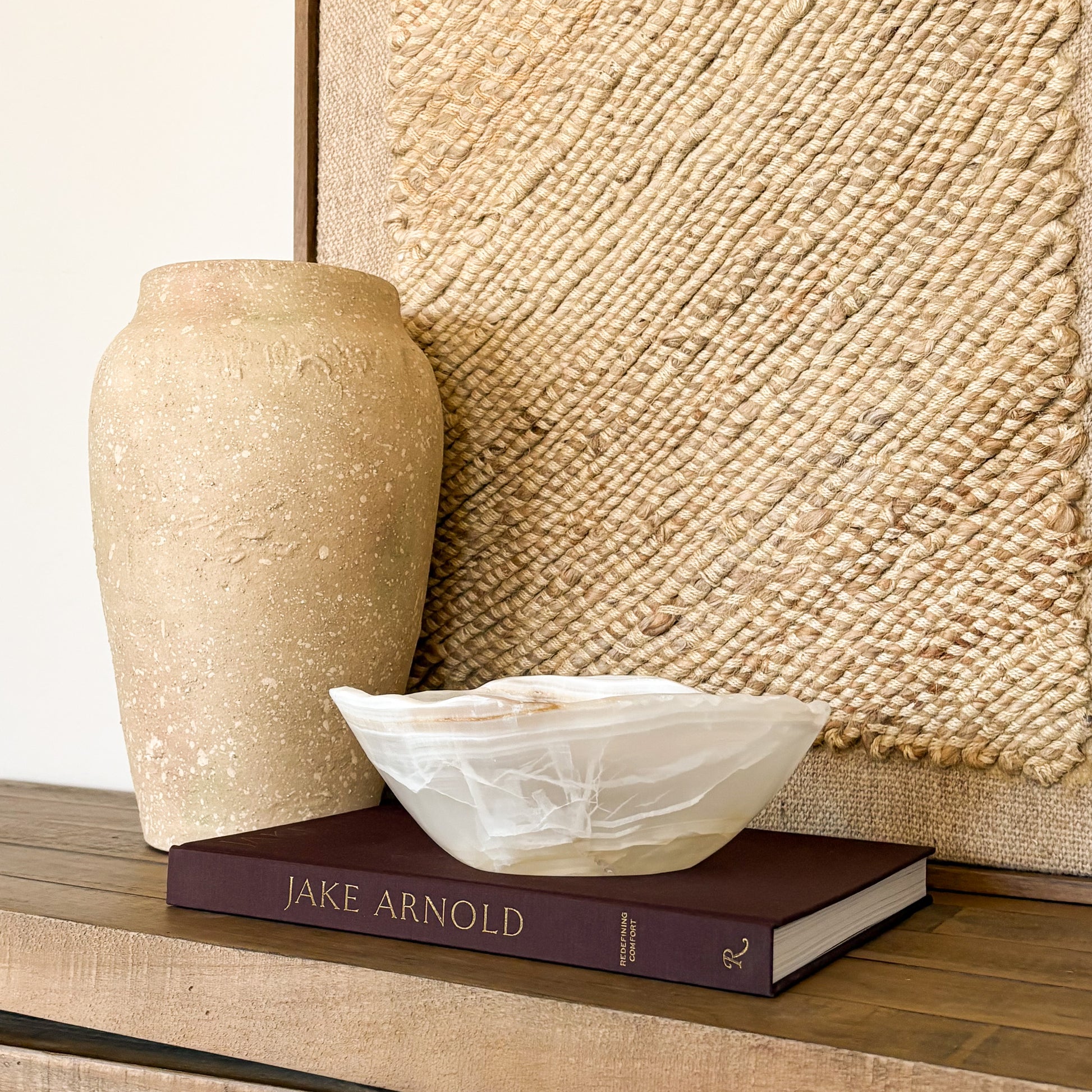 Hand carved amber onyx stone bowl with warm golden tones, artisan decor piece