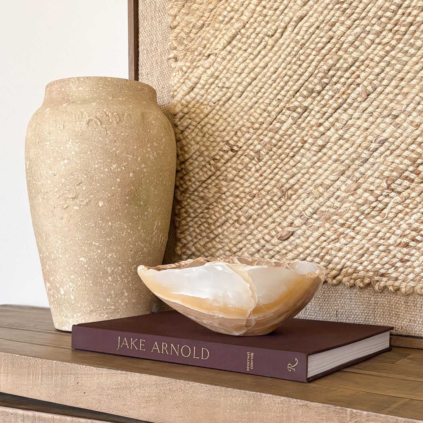 Luxury home decor featuring a hand carved amber onyx bowl with warm golden tones