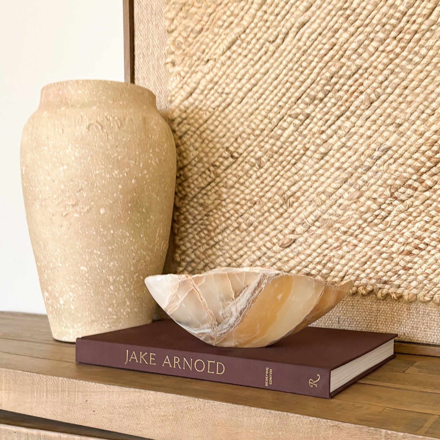 Artisan hand carved amber onyx bowl showcasing polished natural stone luxury decor