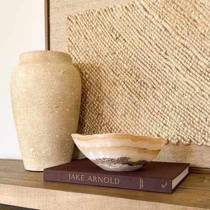 Luxury white and amber onyx decorative bowl displayed in modern interior